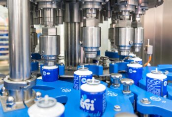 KIWL Machine and Budé Group have commonly developed a unique net weight aseptic monobloc filler/crimper for whipped cream in aerosols at high speed.